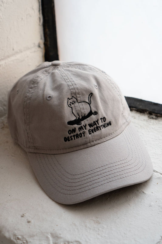 On My Way to Destroy Everything Skateboard Cat Light Gray Dad Hat