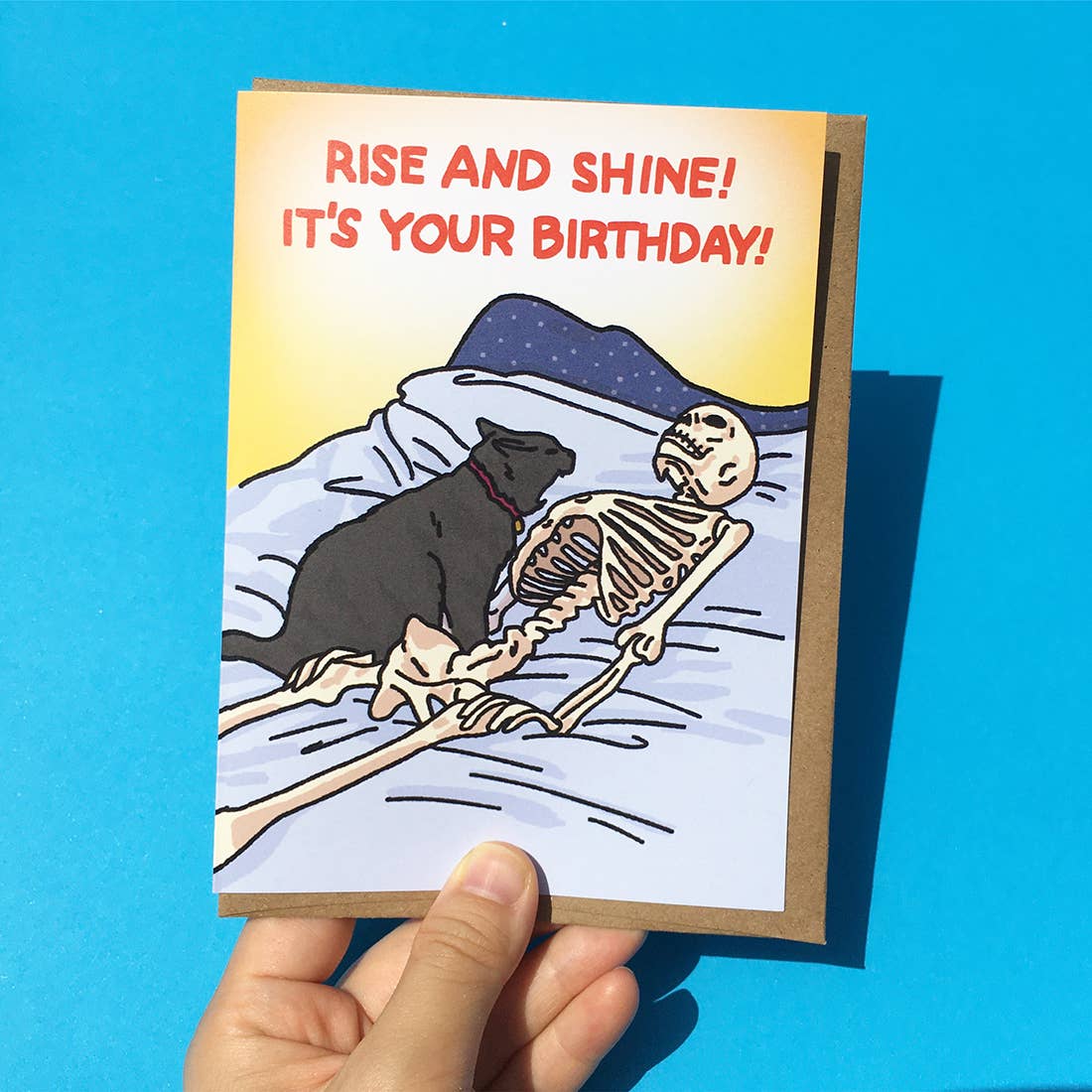 Rise and Shine, It's Your Birthday Cat Yelling at Skeleton Card